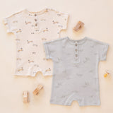 Rylee & Cru Short Sleeve One-Pieces in Race Car and Airplanes laid out with wooden toys
