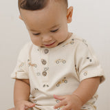 Baby looking down while wearing the Rylee & Cru Short Sleeve One-Piece in Race Car