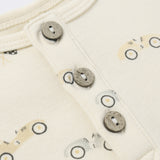 Close-up of the wooden buttons and race car print on the Rylee & Cru Short Sleeve One-Piece in Race Car