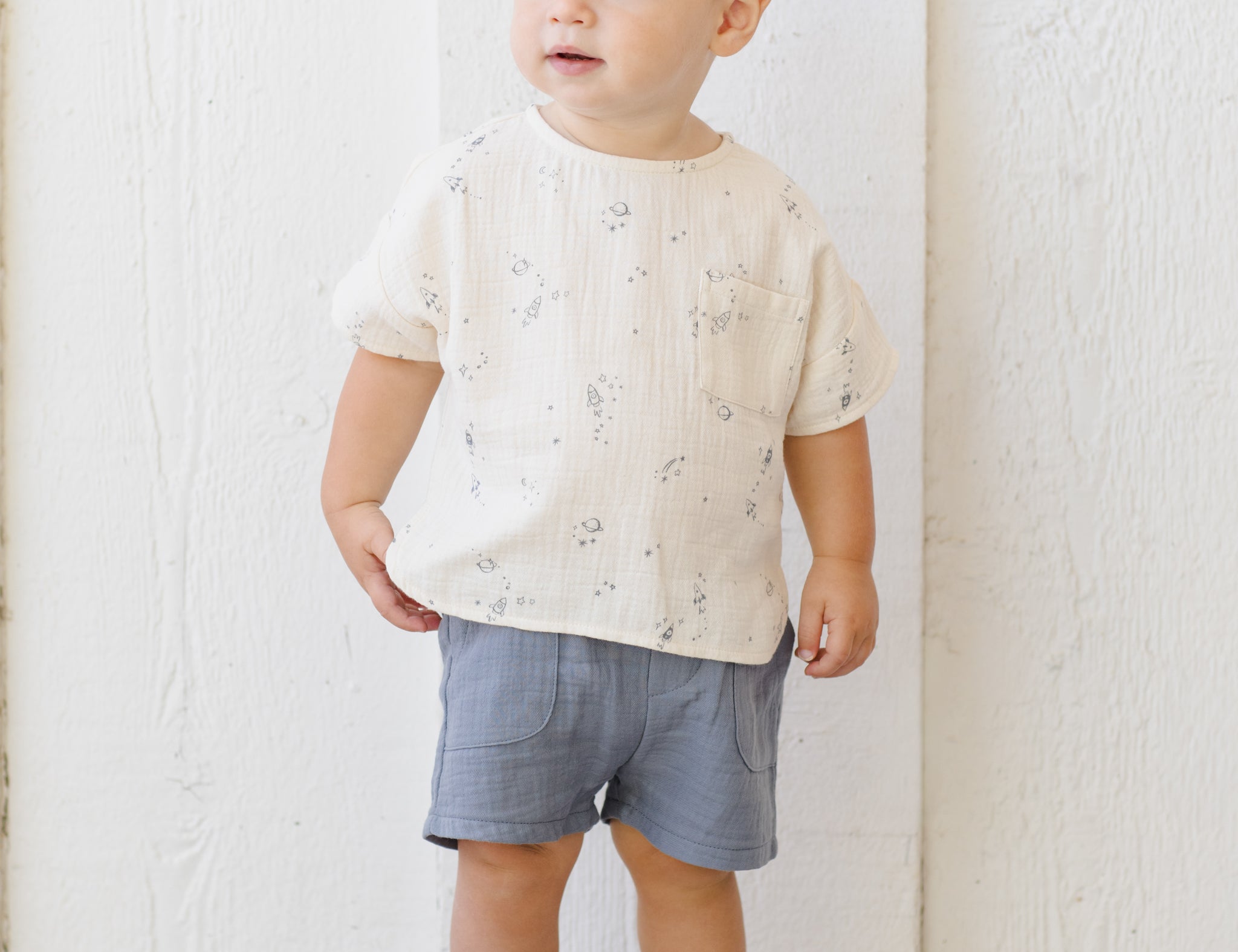 Toddler in a cream printed tee wearing the Rylee & Cru Utility Short in Ocean