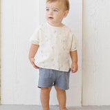 Toddler in a cream printed tee wearing the Rylee & Cru Utility Short in Ocean