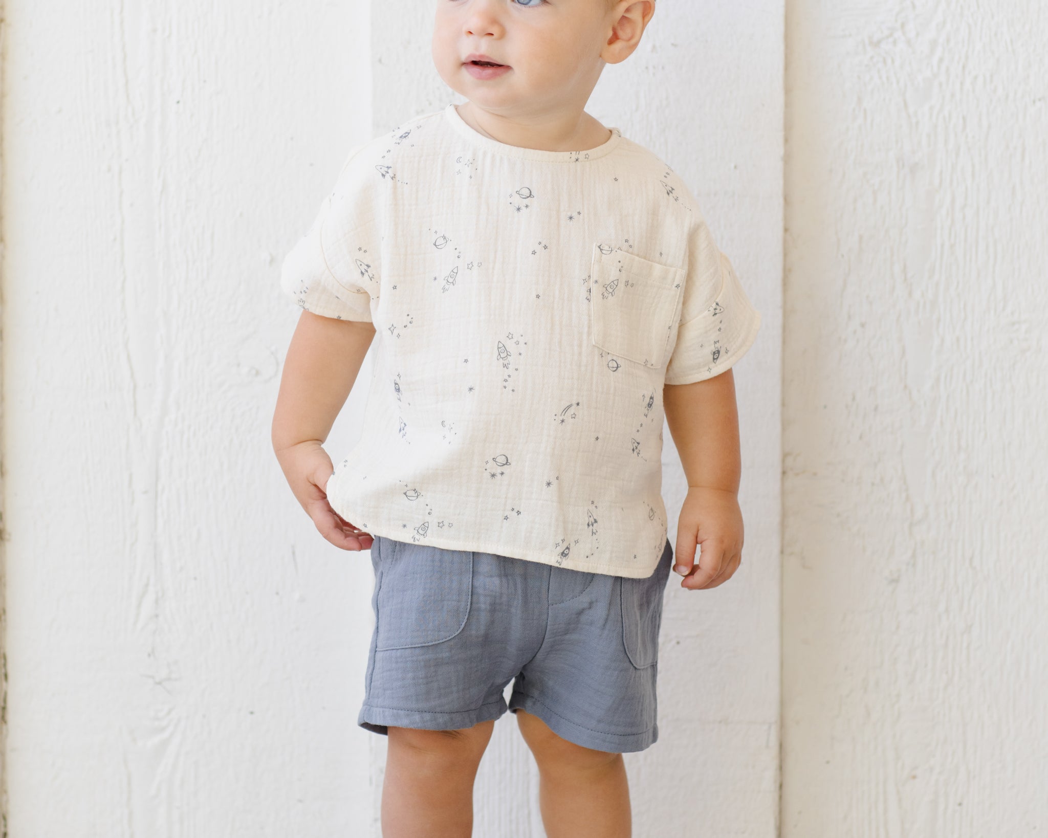 Toddler in a cream printed tee wearing the Rylee & Cru Utility Short in Ocean