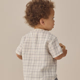 Back view of a toddler in a plaid shirt and Rylee & Cru Utility Short