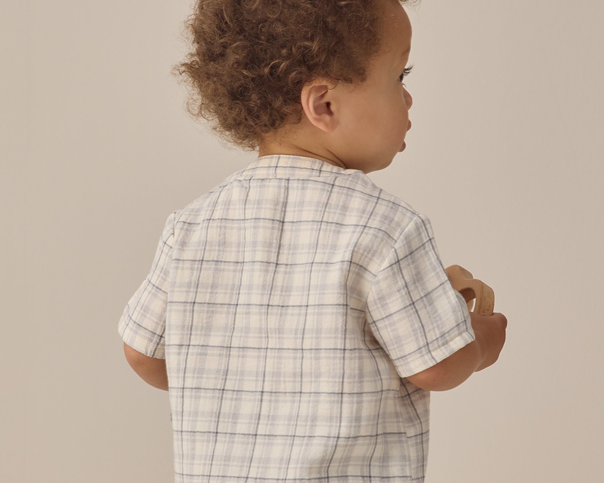 Back view of a toddler in a plaid shirt and Rylee & Cru Utility Short