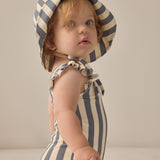 Baby wearing the Rylee & Cru Youth Bucket Hat in Marigold Stripe, side view
