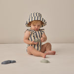 Baby playing with toys wearing the Rylee & Cru Youth Bucket Hat in Retro Stripe Ocean