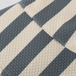 Close-up of the navy and cream stripe fabric on the Rylee & Cru Youth Bucket Hat in Retro Stripe Ocean