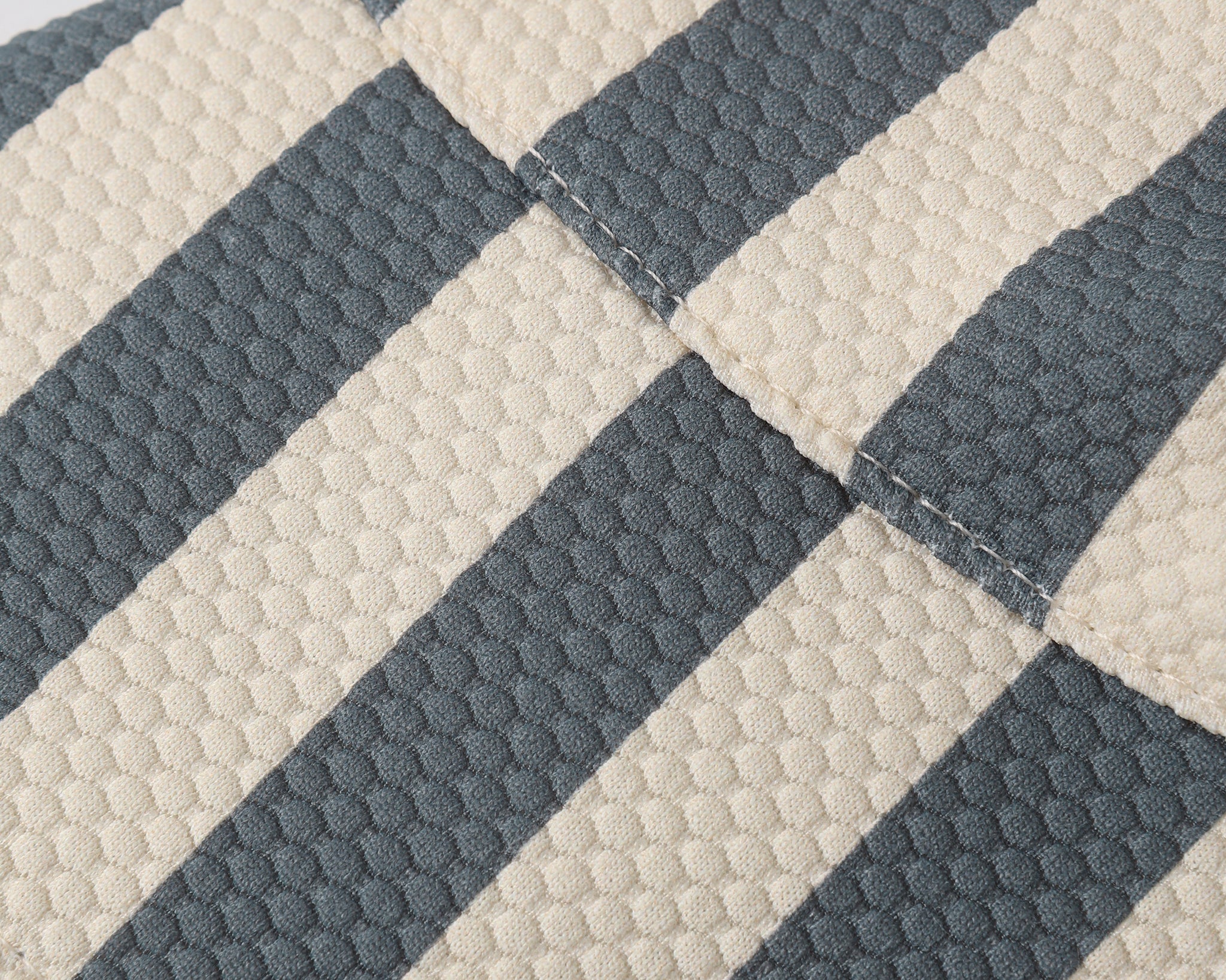 Close-up of the navy and cream stripe fabric on the Rylee & Cru Youth Bucket Hat in Retro Stripe Ocean