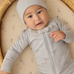 Baby wearing the Rylee & Cru Zip Longsleeve Sleeper in Airplane, close-up of the front zipper and light blue print