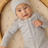 Baby wearing the Rylee & Cru Zip Longsleeve Sleeper in Airplane, close-up of the front zipper and light blue print