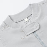 Close-up of the snap collar and zipper on the Rylee & Cru Zip Longsleeve Sleeper in Airplane