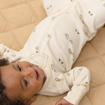 Baby wearing the Rylee & Cru Zip Longsleeve Sleeper in Race Car showing the front zipper