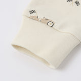 Close-up of the ribbed cuff and race car print on the Rylee & Cru Zip Longsleeve Sleeper in Race Car