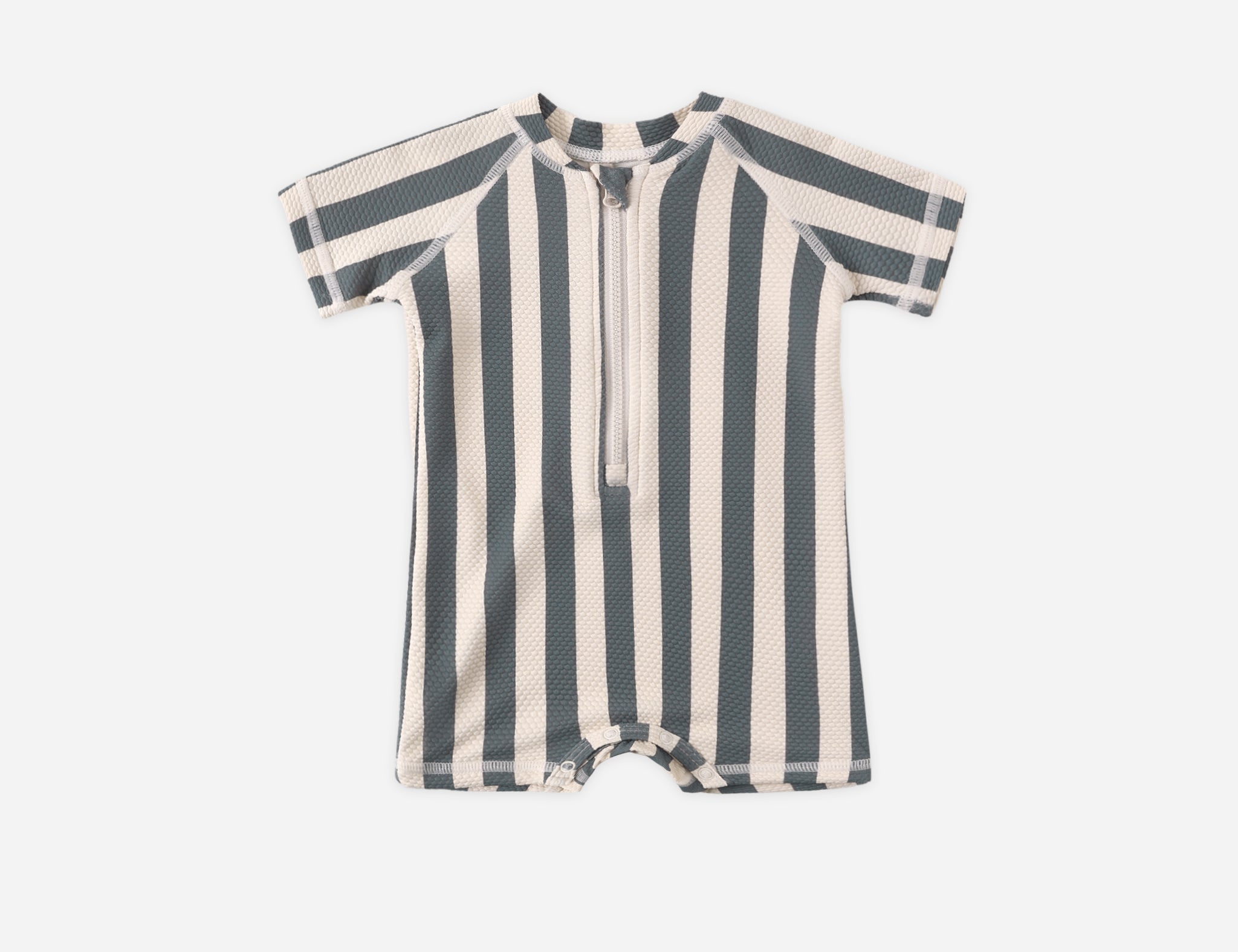 Rylee & Cru Zip Rashguard One-Piece in Retro Ocean Stripe, a navy and cream striped short-sleeve baby swimsuit with a front zipper