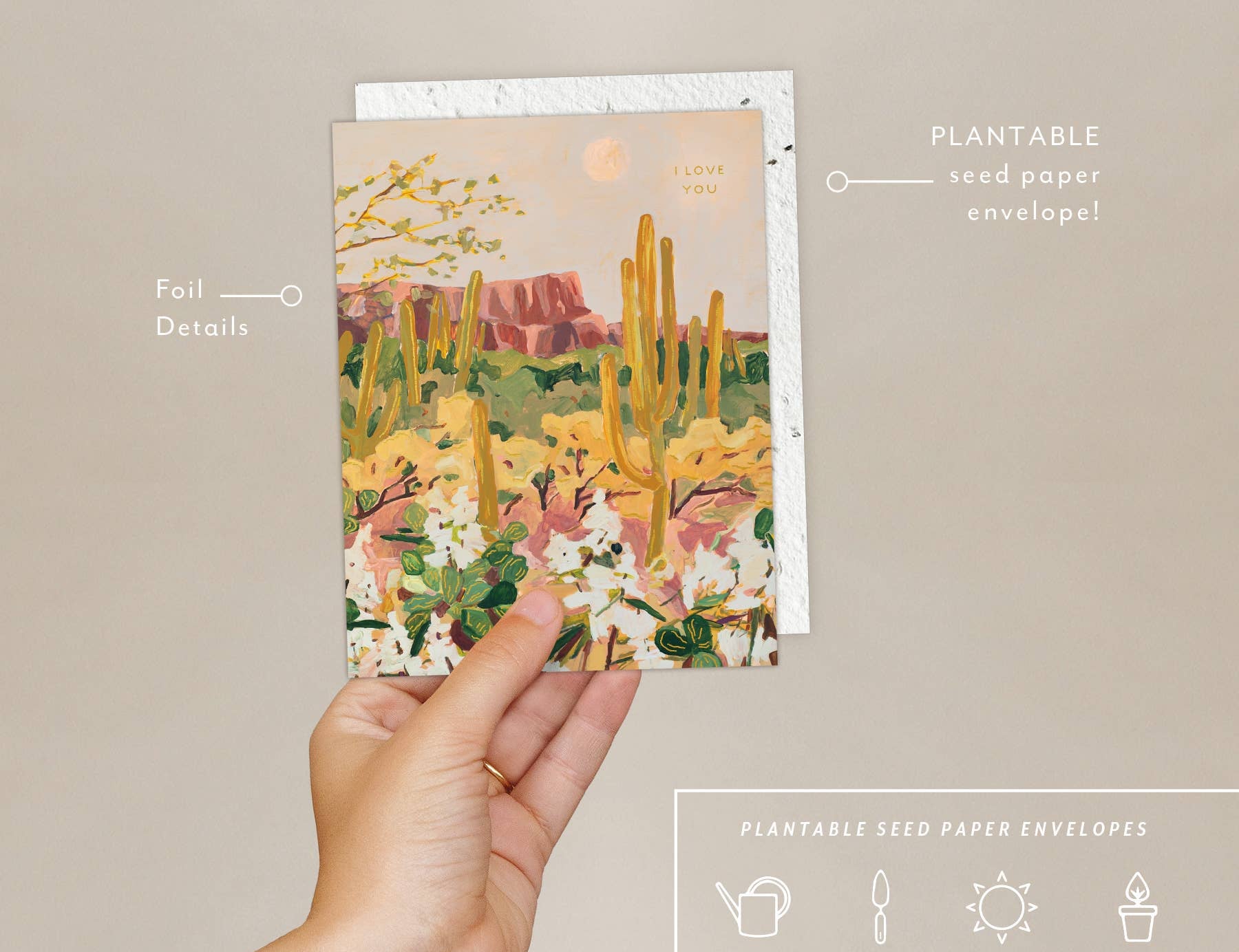 Hand holding the Seedlings Desert Moonlight card with its plantable seed paper envelope and instructions