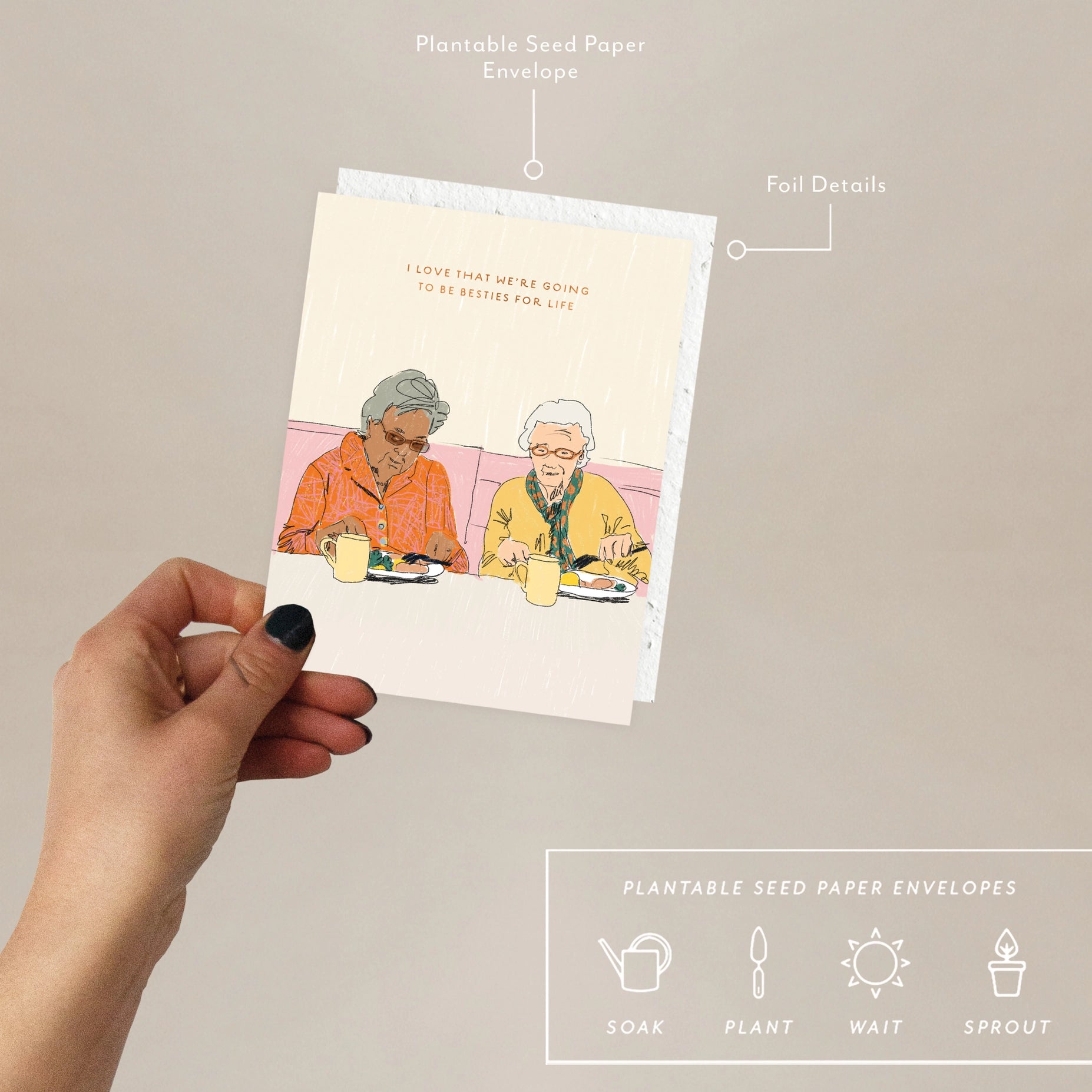 Hand holding the Seedlings Forever Friends card with its plantable seed paper envelope and instructions