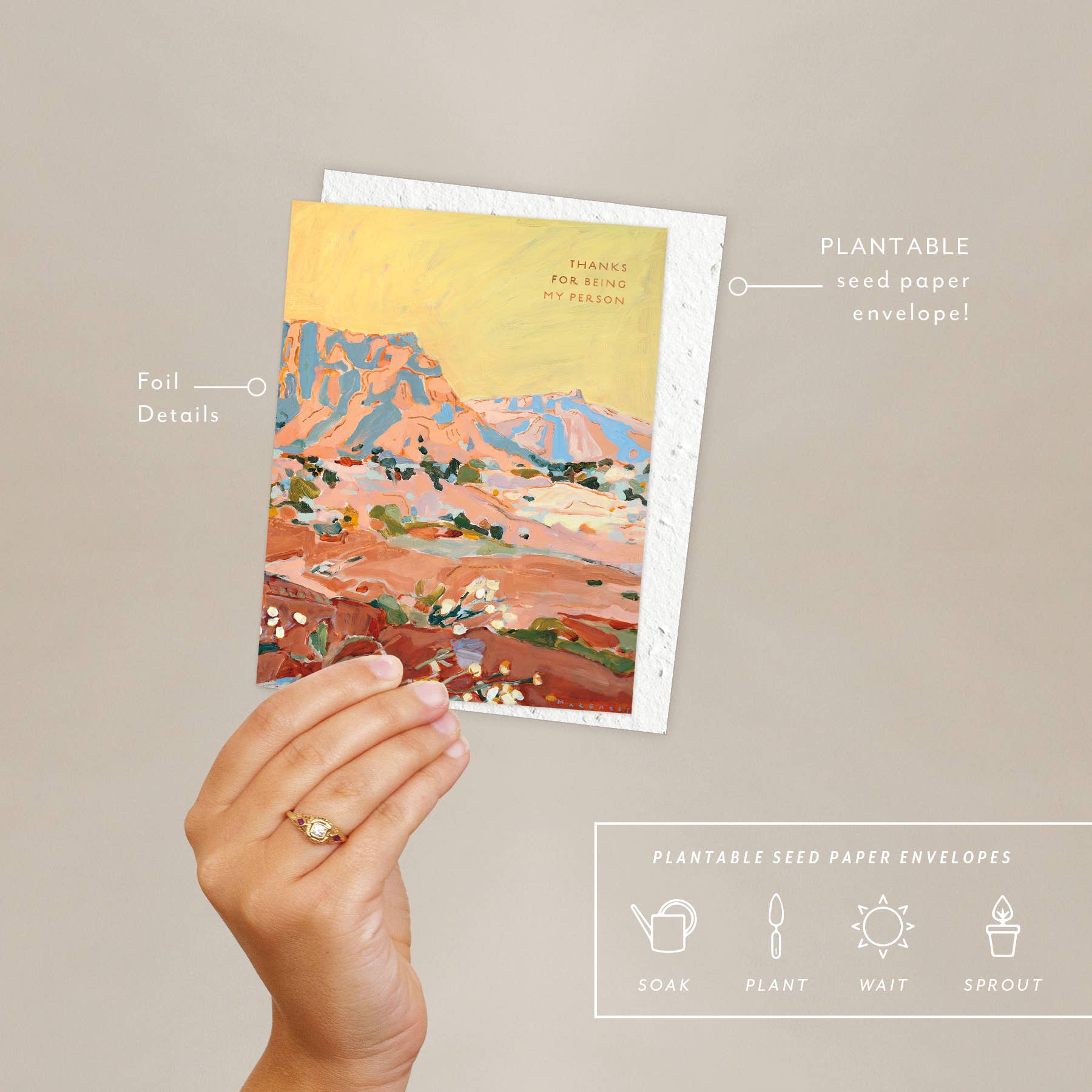 Hand holding the Seedlings Shadow Rocks card with its plantable seed paper envelope and instructions