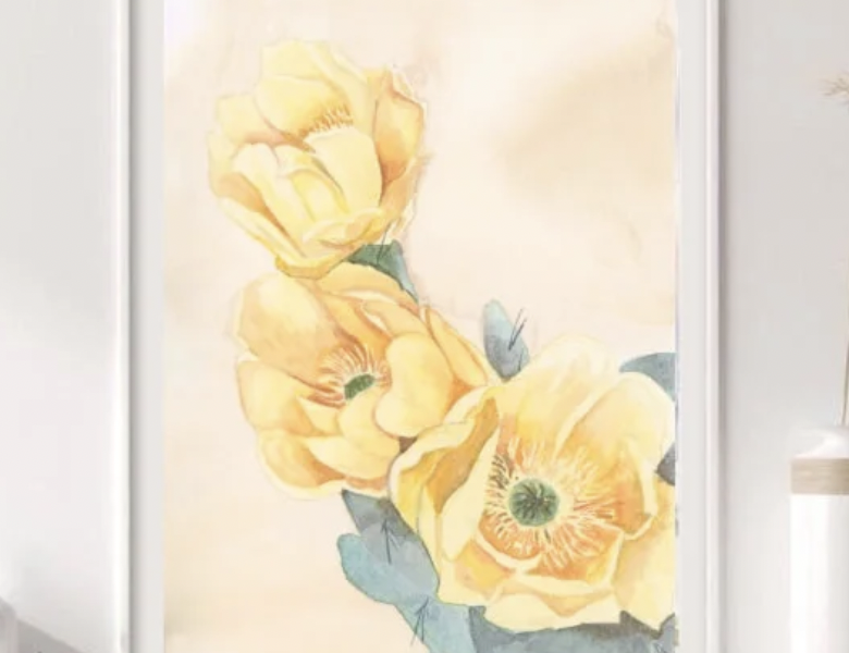 Sierra McGuire Art 11x14 print of yellow watercolor poppies with green leaves in a white frame on a wall