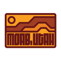 Simply Moab Buttes Pin, rectangular enamel pin with an orange sun over layered rust mesas and bold MOAB, UTAH lettering