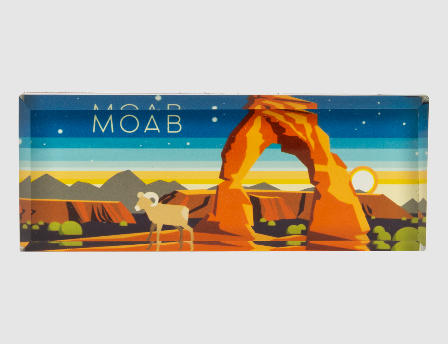 Glass Moab magnet with Delicate Arch in orange under a layered sunset sky and a bighorn sheep