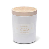 Skeem Black Currant Candle in a white glass jar with a natural wood lid
