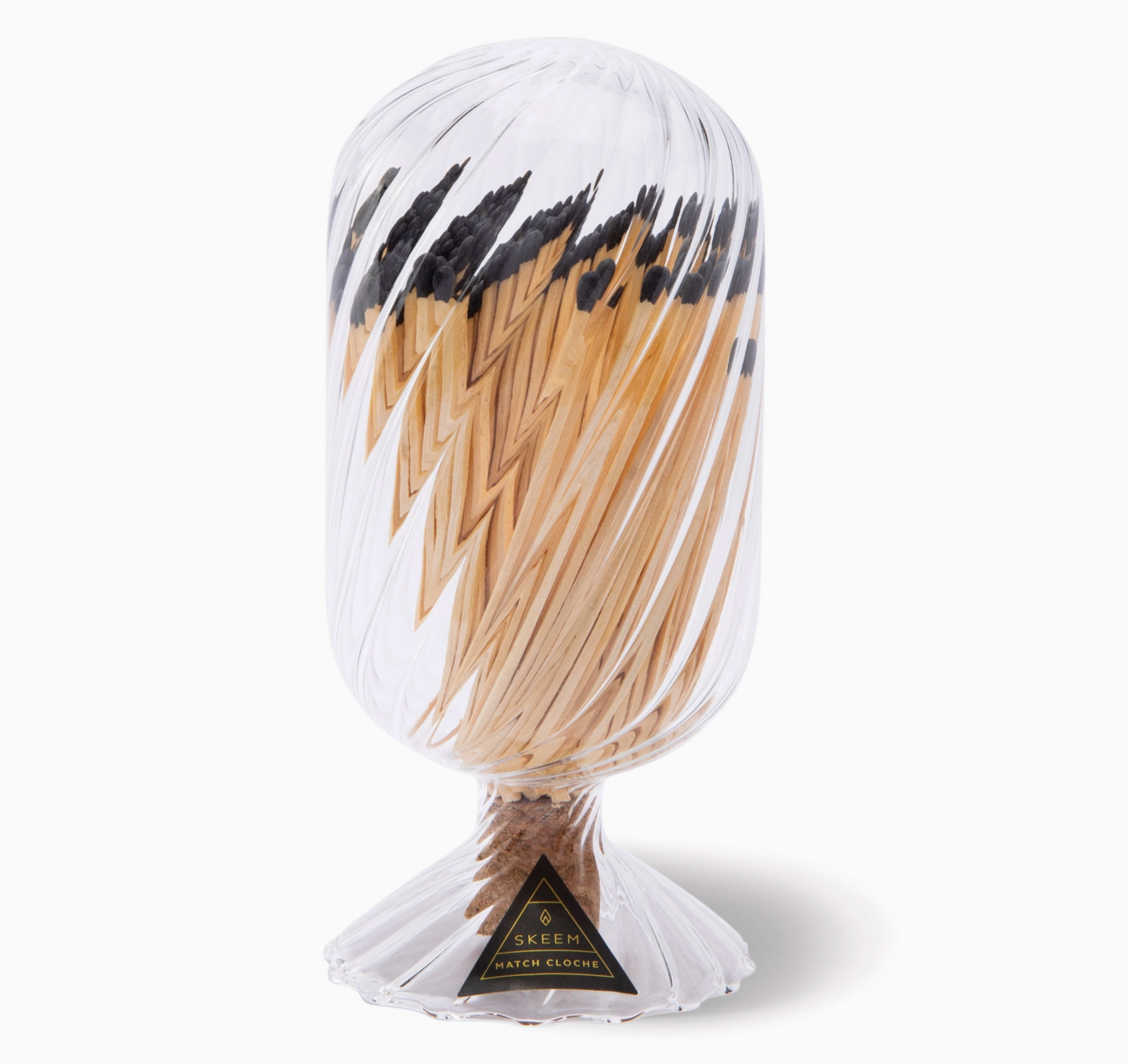 Skeem Helix Match Cloche, a twisted glass cloche filled with long matches on a metal base