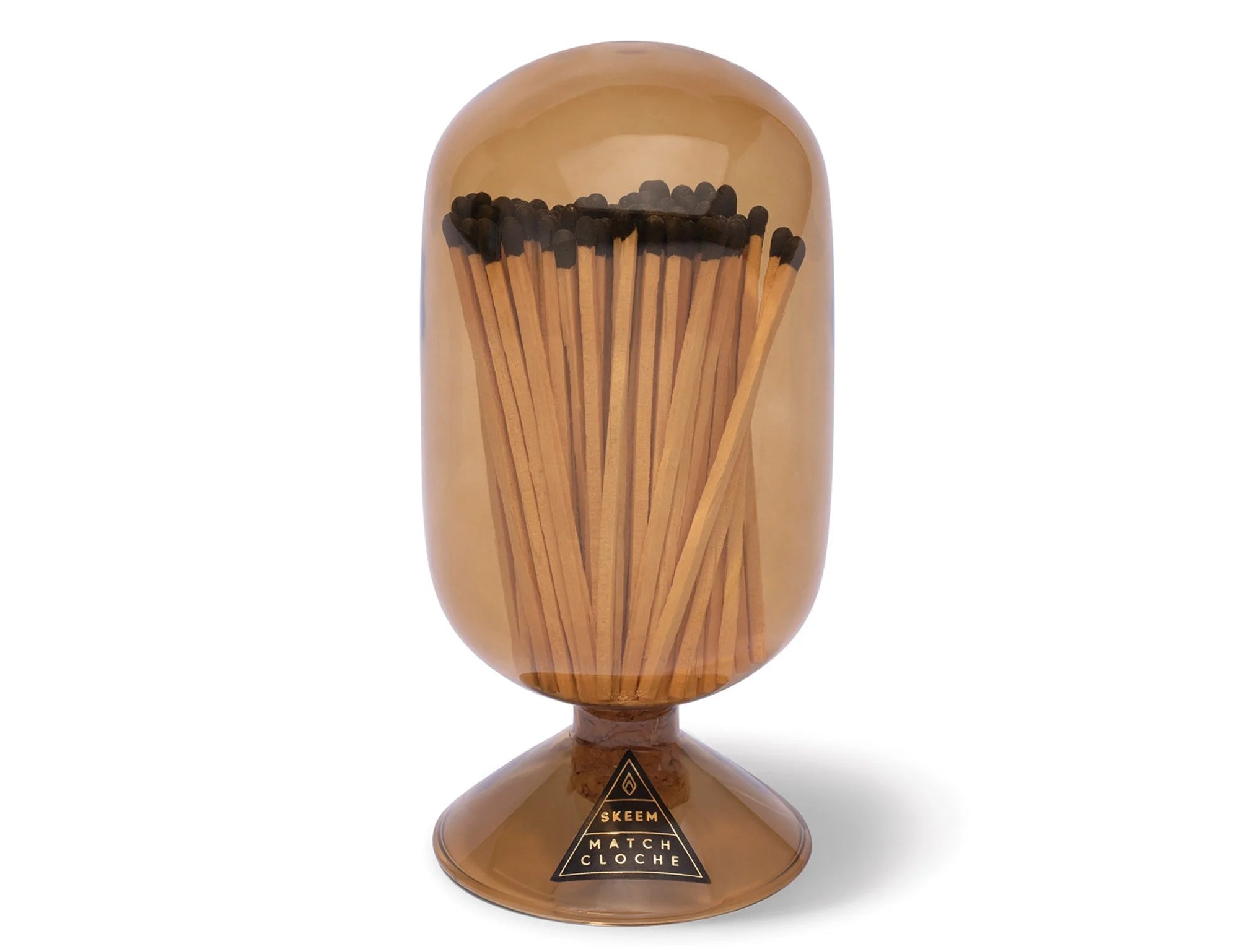 Skeem Match Cloche in Amber, a glass dome filled with long matches on a footed base