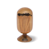 Skeem Match Cloche in Amber, a glass dome filled with long matches on a footed base