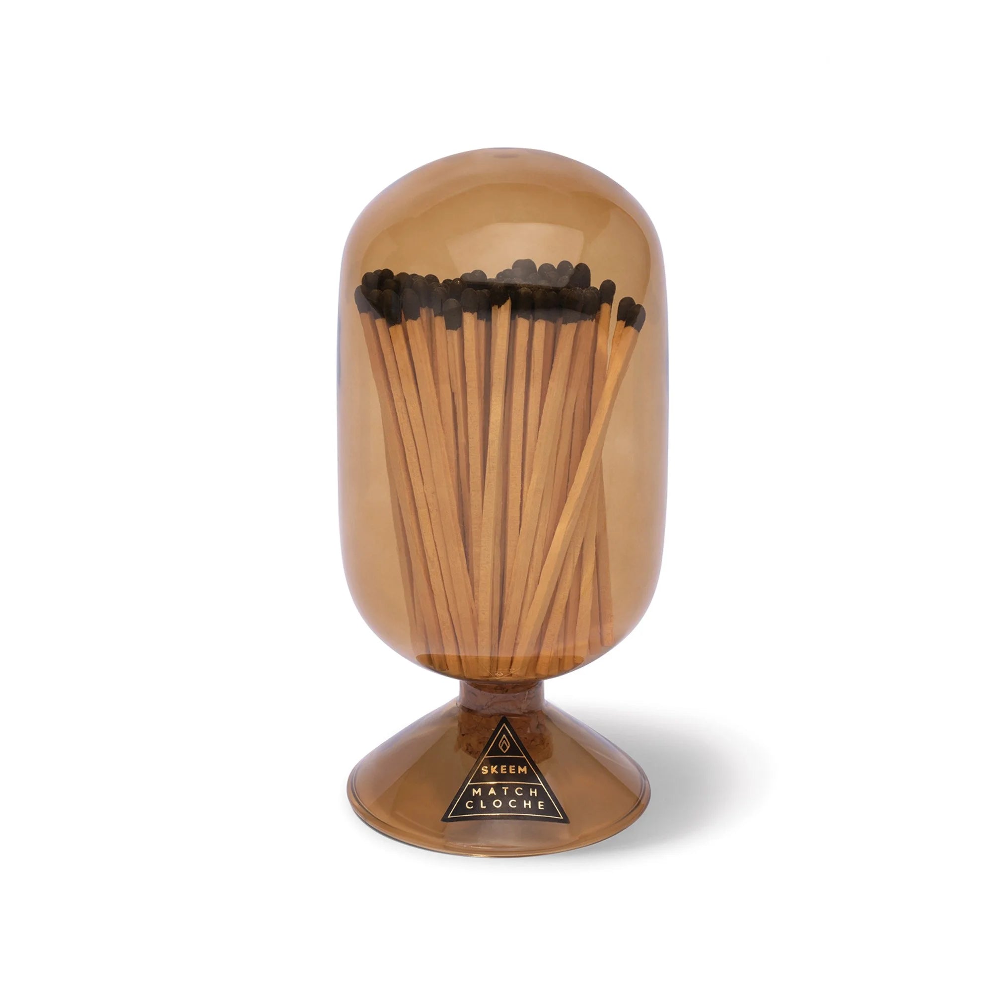 Skeem Match Cloche in Amber, a glass dome filled with long matches on a footed base