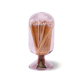 Skeem Match Cloche in Violet, a purple glass dome filled with long matches on a footed base