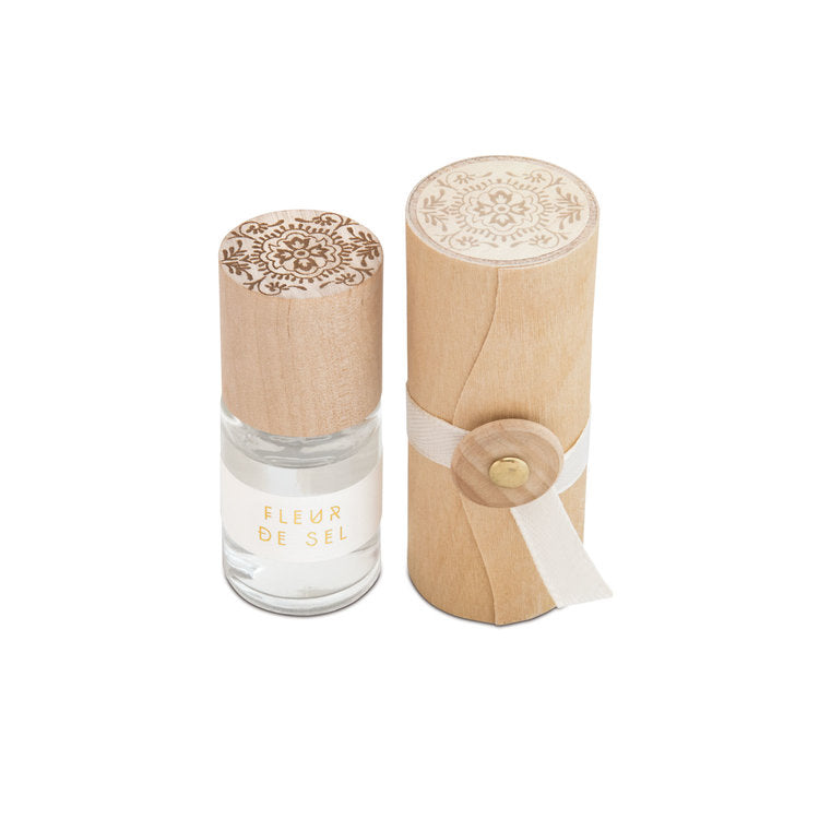 Skeem Print Block Perfume in Fleur De Sel, a small rollerball bottle beside its carved wooden print block case