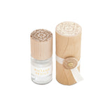 Skeem Print Block Perfume in Vintage Peony, a small rollerball bottle beside its carved wooden print block case
