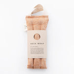 Slow North Hot + Cold Neck Wrap in Copper Fields, a terracotta crosshatch wrap with a kraft Neck Wrap sleeve