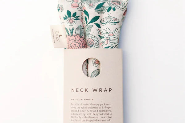 Slow North Hot + Cold Neck Wrap in Hidden Falls, a cream floral wrap with a kraft Neck Wrap sleeve