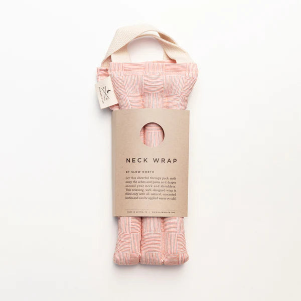 Slow North Hot + Cold Neck Wrap in Pink Pampas, a soft pink wrap with a kraft Neck Wrap sleeve