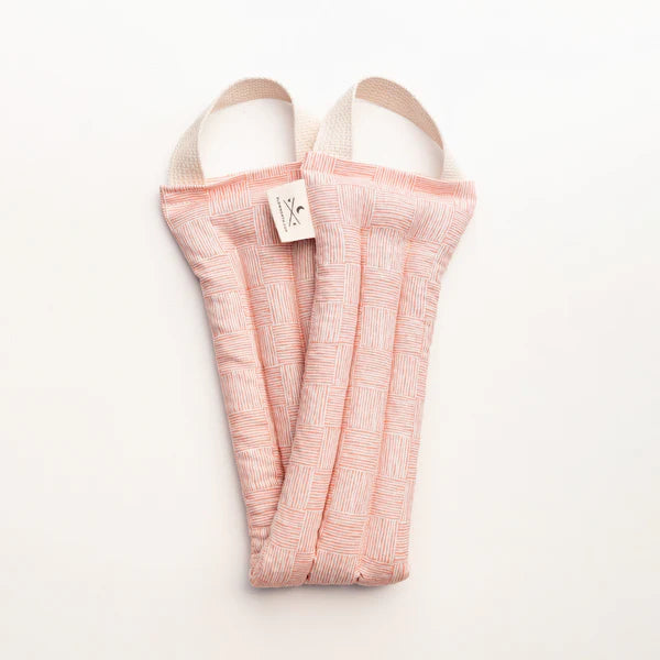 Slow North Hot + Cold Neck Wrap in Pink Pampas, a soft pink textured wrap, laid flat