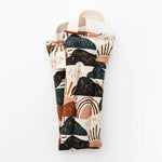 Slow North Hot + Cold Neck Wrap in Rainbow Hill, an abstract navy, rust and cream print, laid flat