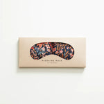 Slow North Migraine Mask in Pom Blossom on its kraft packaging card