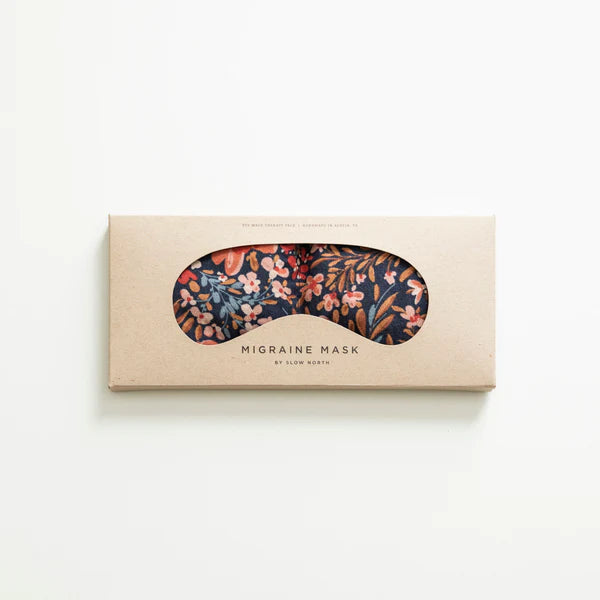 Slow North Migraine Mask in Pom Blossom on its kraft packaging card