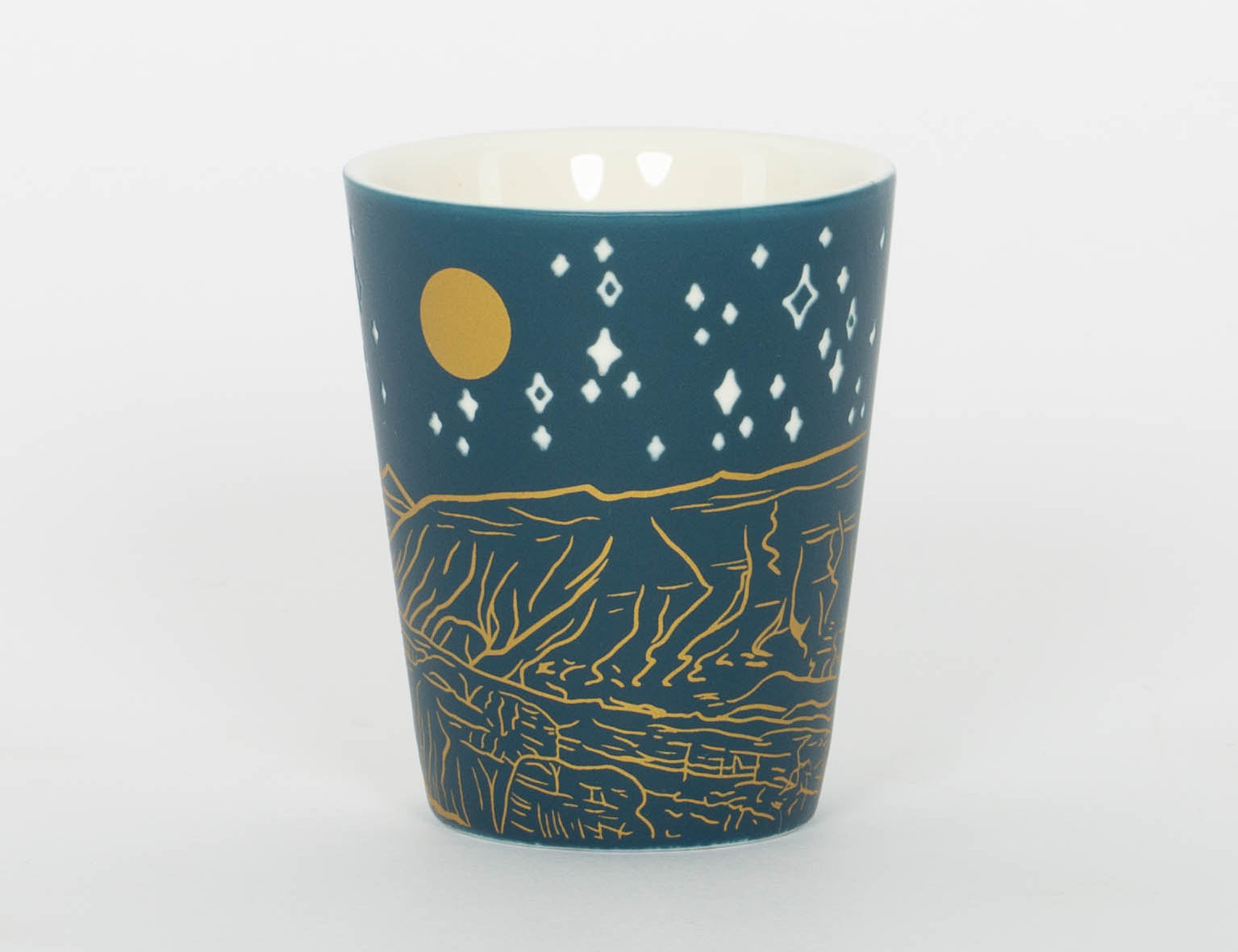 Deep blue etched Moab shot glass with Delicate Arch under a starry sky, second view