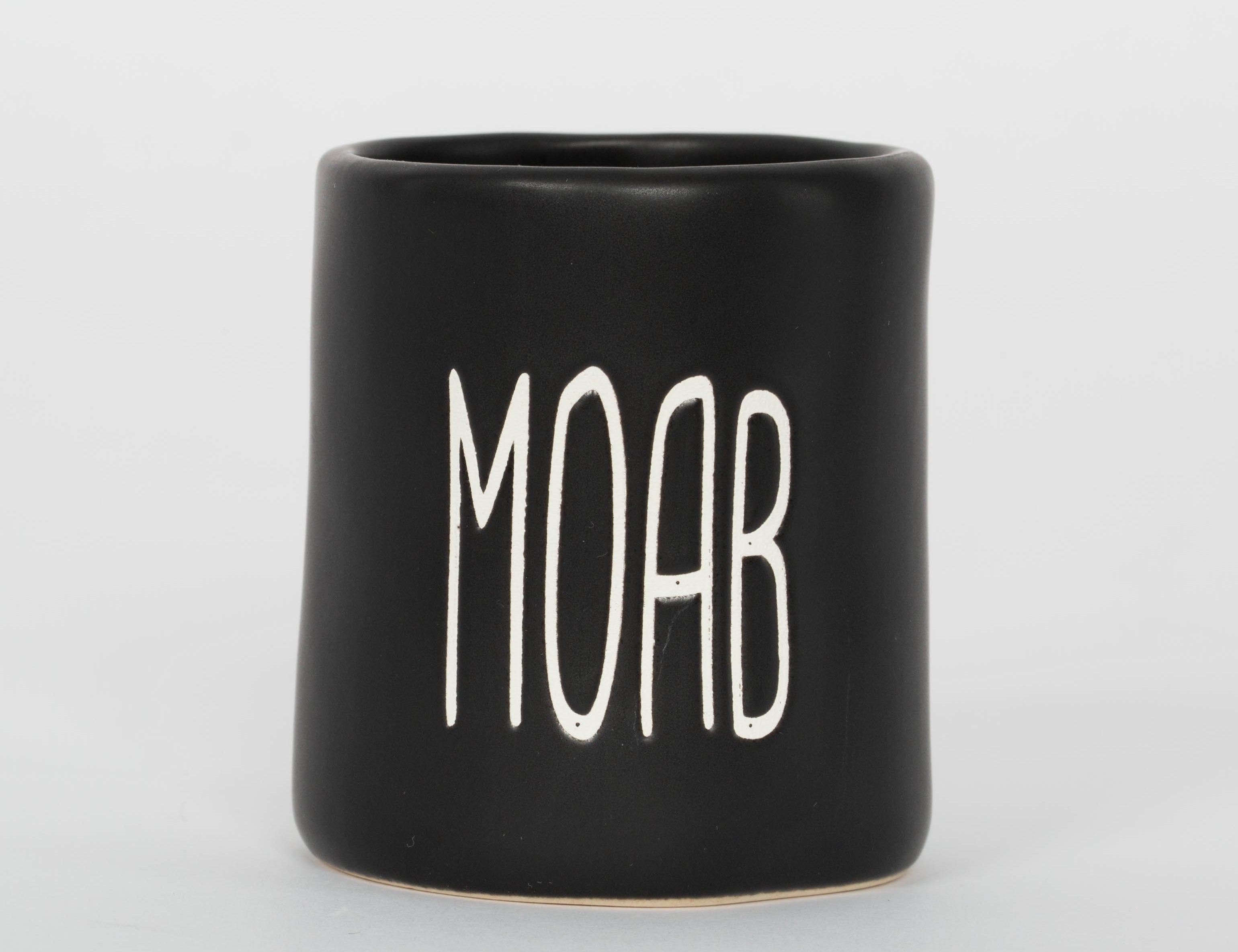Matte black Moab shot glass with tall minimal lettering