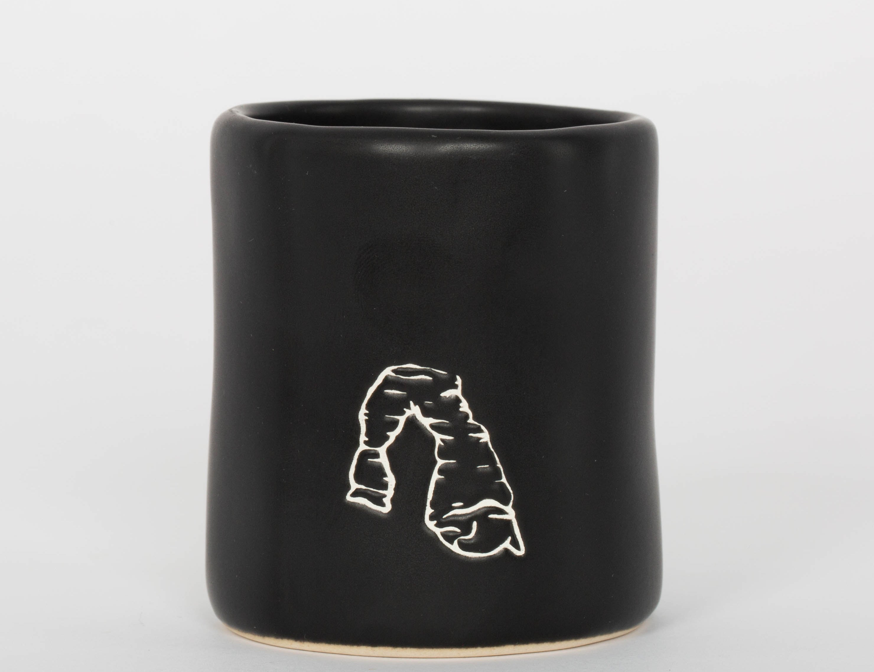 Matte black Moab shot glass with tall minimal lettering, second view