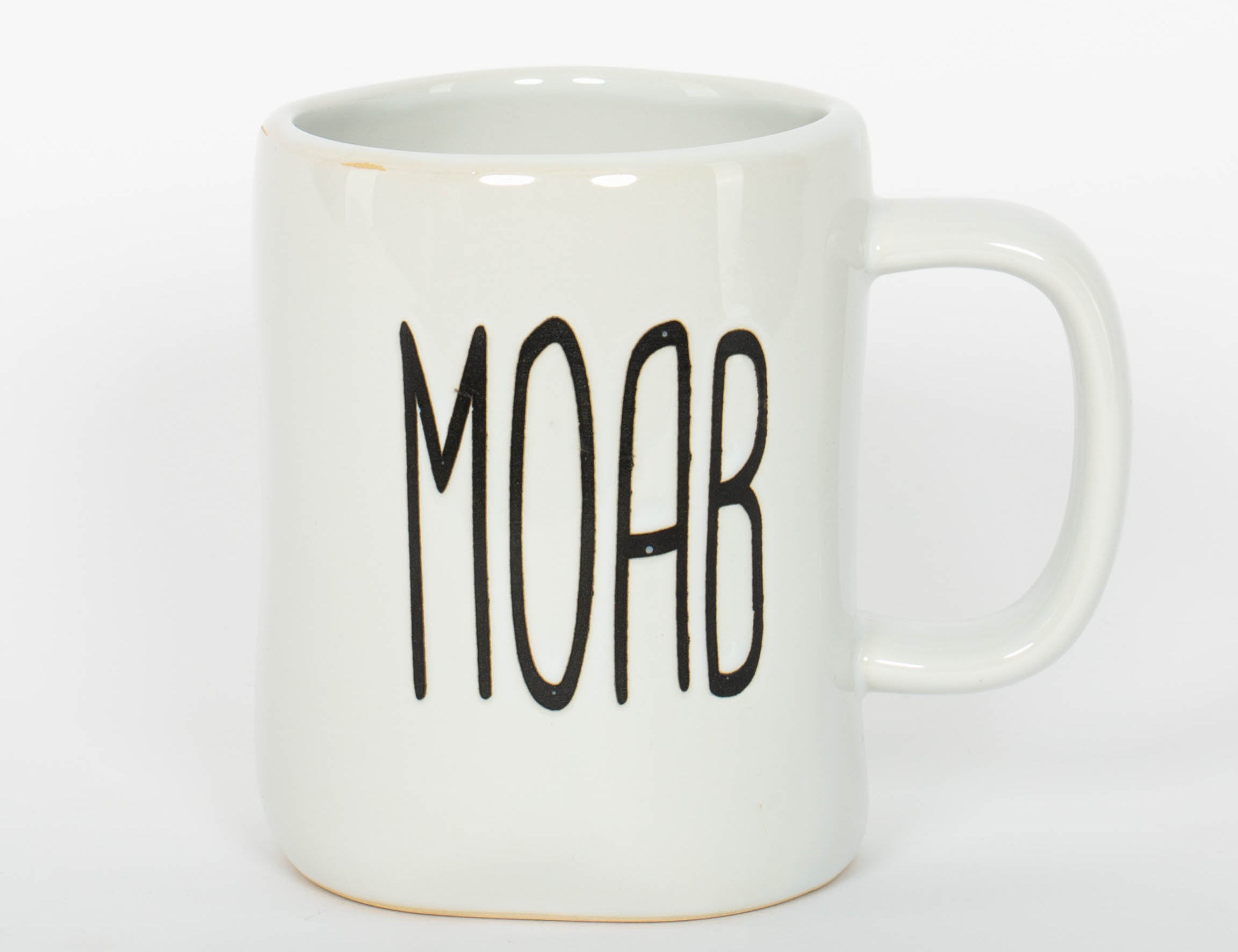 White ceramic Moab mug with a hand drawn arch and bold lettering
