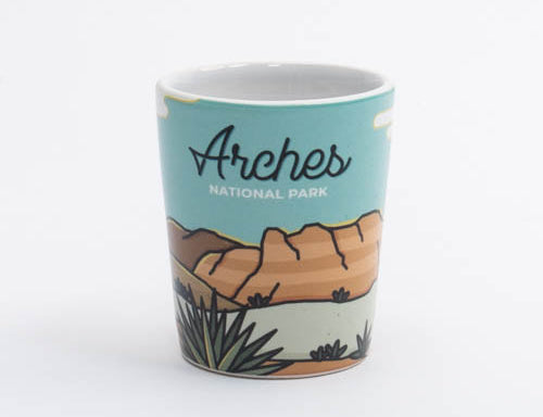 Illustrated Moab shot glass with Delicate Arch against a warm desert sky