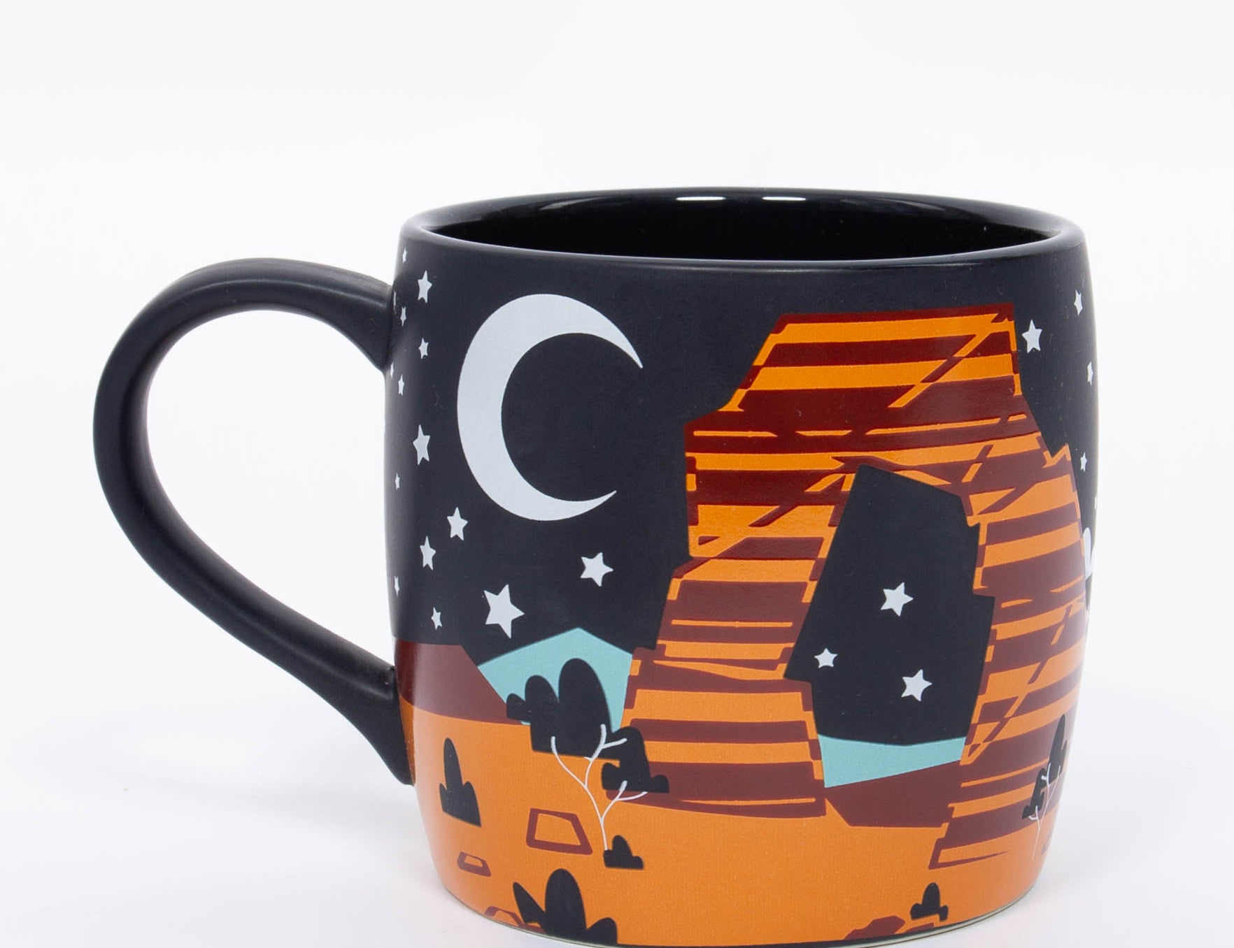 Navy ceramic Moab mug with a crescent moon, stars and layered orange red rock