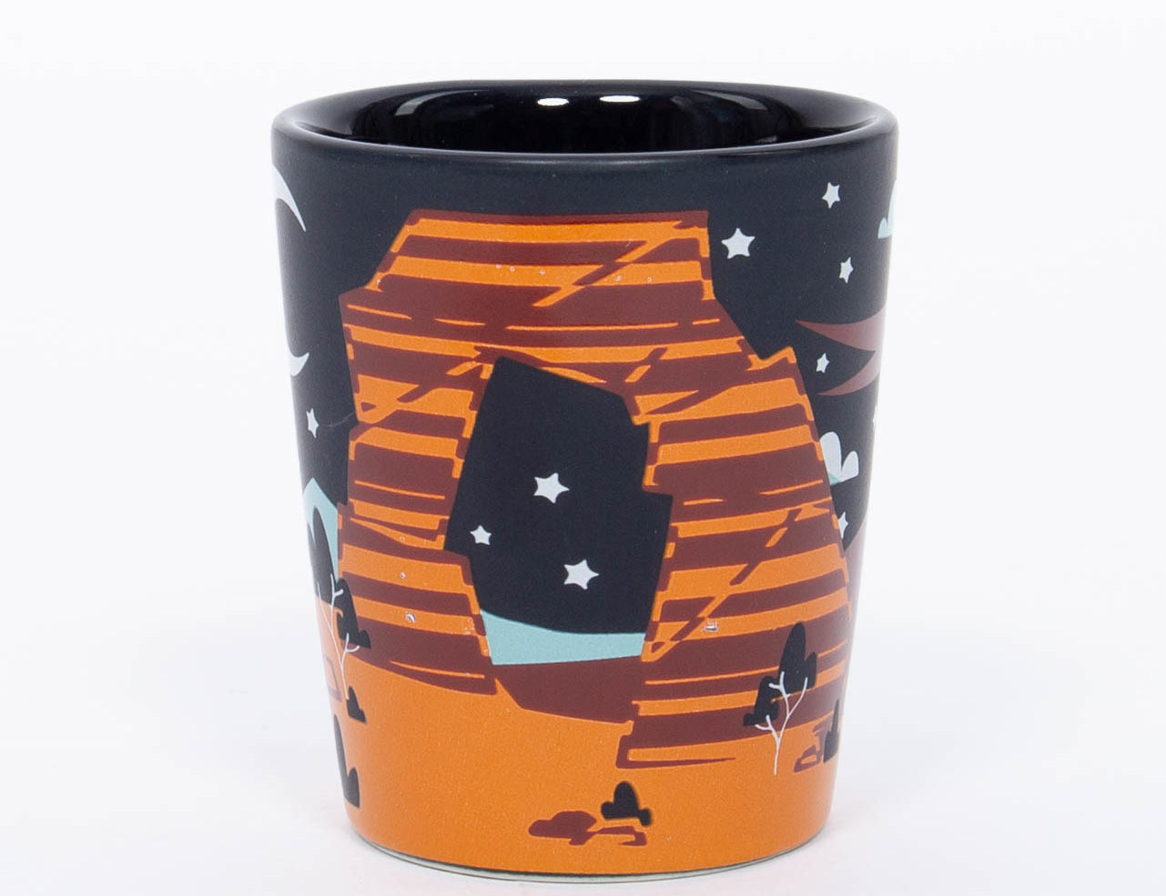 Navy ceramic Moab shot glass with a moon, stars and layered orange red rock