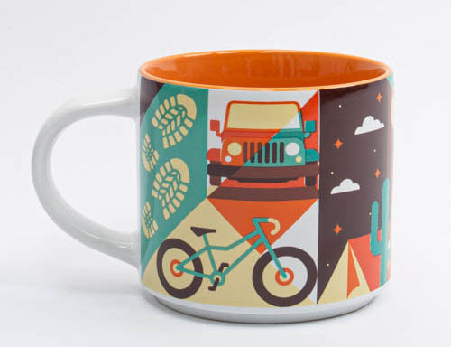 Ceramic Moab mug with a colorful collage of biking, off road and desert nights, second view