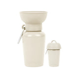 Springer 20 oz Dog Travel Water Bottle in Oat, a cream flip bottle with a collapsible silicone bowl