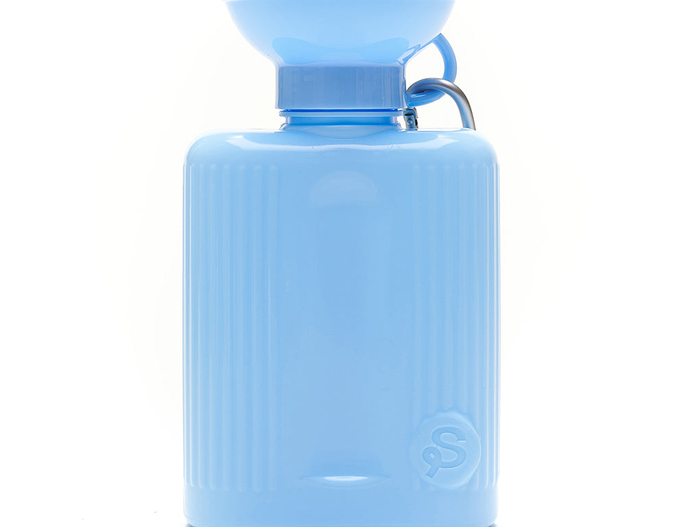 Springer Growler 44 oz Dog Travel Water Bottle in Sky Blue, a ribbed bottle with a wide bowl top and carabiner