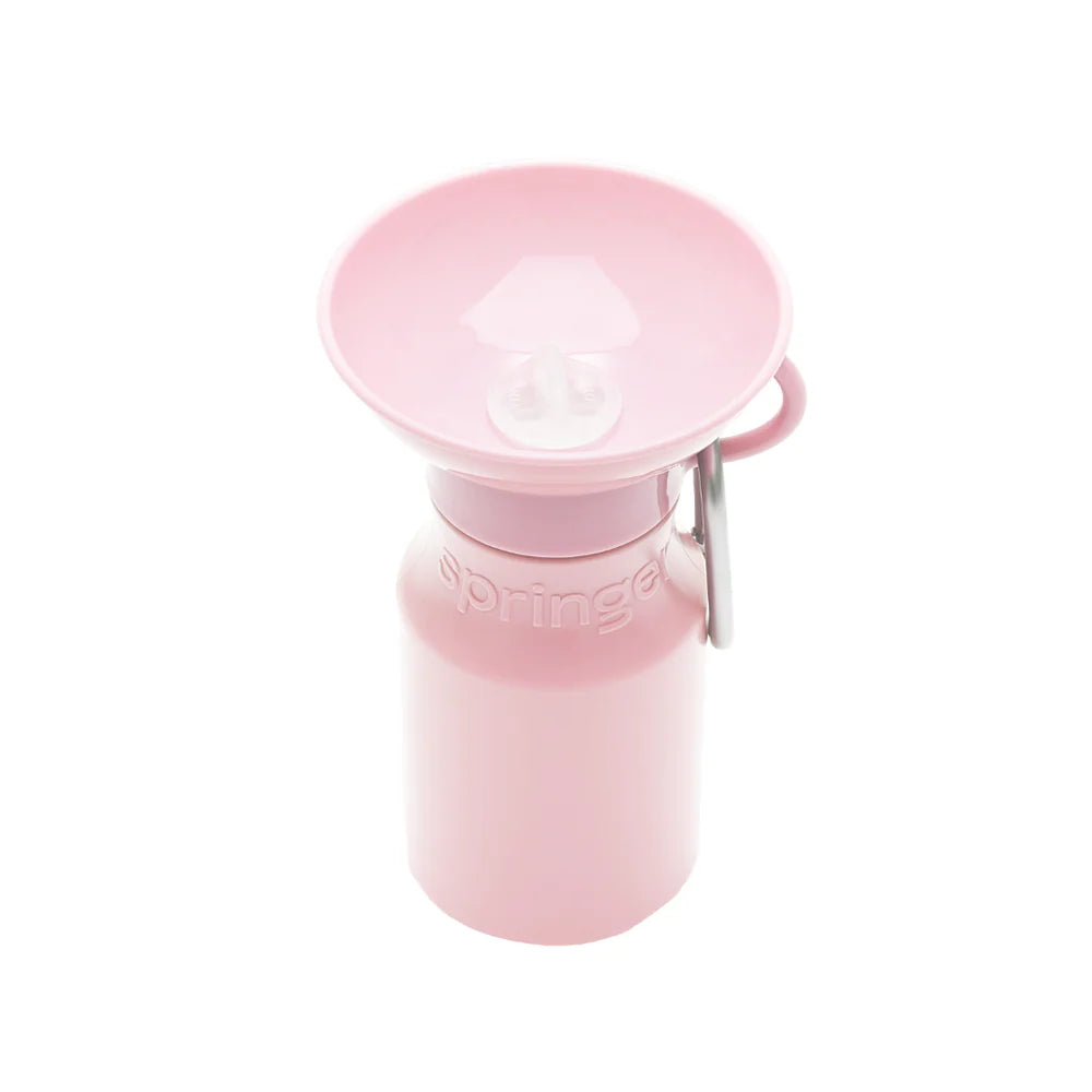 Springer Mini Travel Bottle in Cotton Candy, a light pink 15 oz dog water bottle with a fold-out bowl